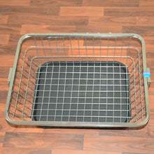 Close-up of stainless steel dish drainer rack with drip tray