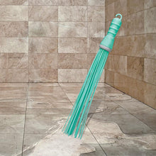 Hard bristle broom with plastic handle, bathroom use