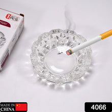 Round crystal ashtray for home or office.