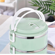 Stainless steel hot lunch box with three compartments.