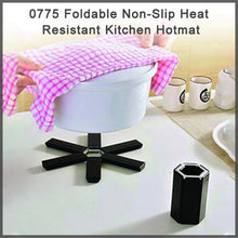 Compact foldable kitchen hot mat, non-slip and heat-resistant.